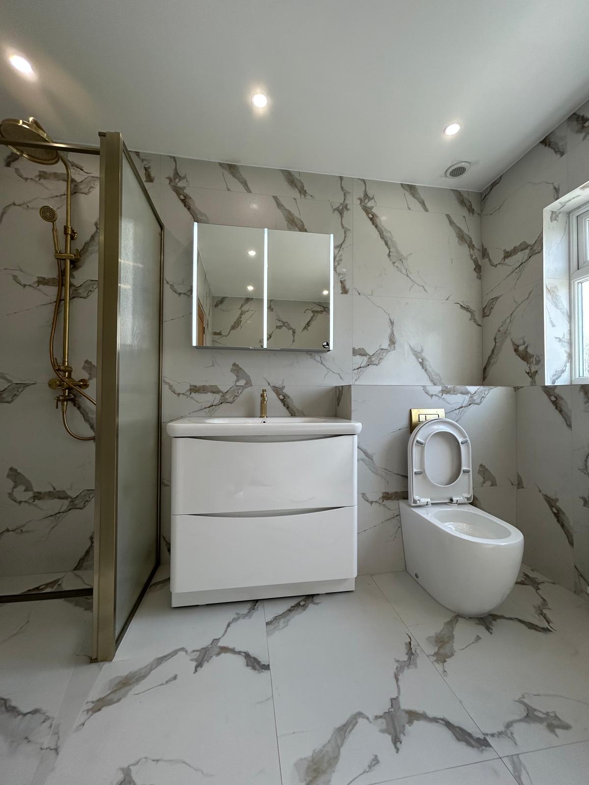 After renovation, finished bathroom with shower, vanity and toilet